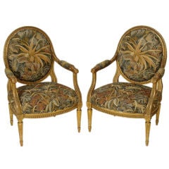 Pair of Louis XVl  gilt wood armchairs