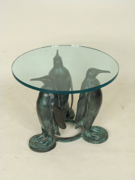 Bronze and glass penguin table, late 20th century.