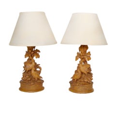 Pair of black forest carved lamps.