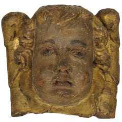 18th century cupid face carving