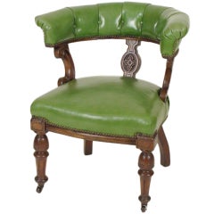Antique Green Leather Upholstered Horseshoe Back Armchair