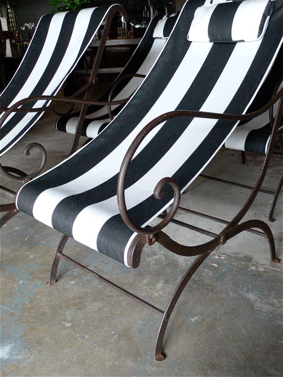 Beautiful set of four folding iron chairs from France. <br />
These would also be wonderful indoors with leather slings.