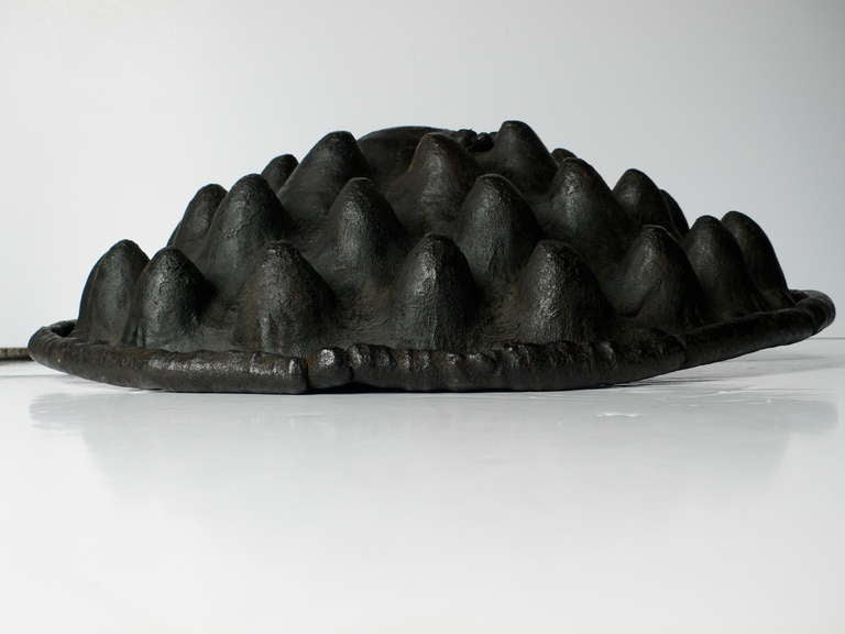 A rare and very unusual 18th - 19th century Ometo/Amarro shield.

The process of making this repoussé shield was extremely involved, laborious and time consuming. 

Dark brown patina with with incredible raised nodules and bulbous rim. Hide