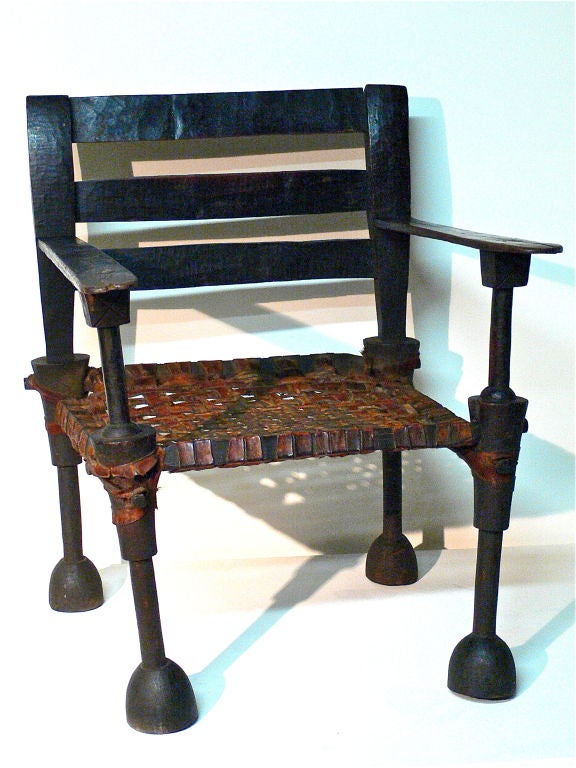 Chief's chair in iron wood and goat skin.<br />
Original patina. Very sturdy.