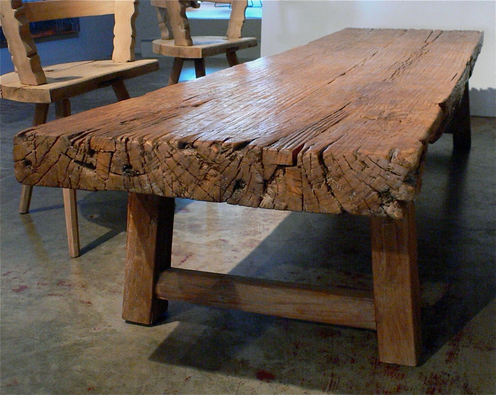 Elm wood. Original finish. <br />
Primitive mends to top surface.<br />
Table top:  3.25
