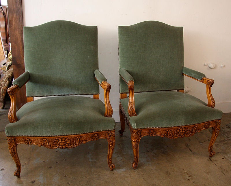 Pair of c. 1900, French walnut arm chairs in green mohair.