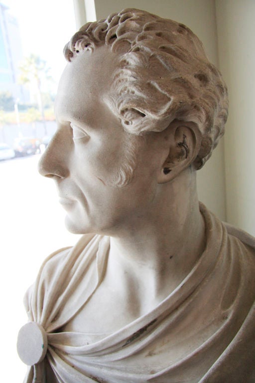 Large, hand-carved bust of a man in draped in a clasped robe by prominent, Scottish, Royal Acadmey member, Patric Park (18l1-1855).

From the article, 