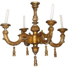 A Baroque carved, gilded and silvered four-arm chandelier