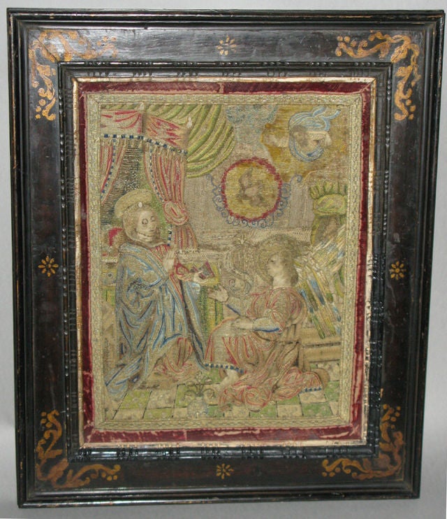 A silk and metal thread embroidery of The Annunciation; framed in a period Italian cassetta frame<br />
<br />
The present embroidery after a famous engraving by Federico Barocci (called Fionda Urbino), a painter and engraver born 1526 in Urbino