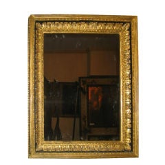 A pair of painted, gilt mirrors swith acanthus leaf decoration