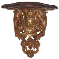 A Regence gilt wood wall bracket with a marble top