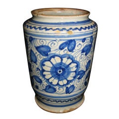 A CONICAL SHAPED ALBARELLO WITH BLUE AND WHITE FLORAL MOTIF