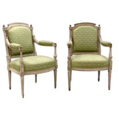 A pair of painted beech wood Louis XVI armchairs (Fauteuils)