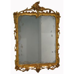 Antique A carved and gilded openwork wood mirror