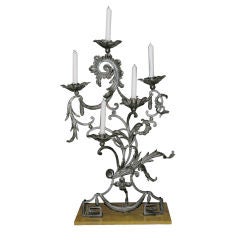 An Unusual Pair Of Wrought Iron Candelabra
