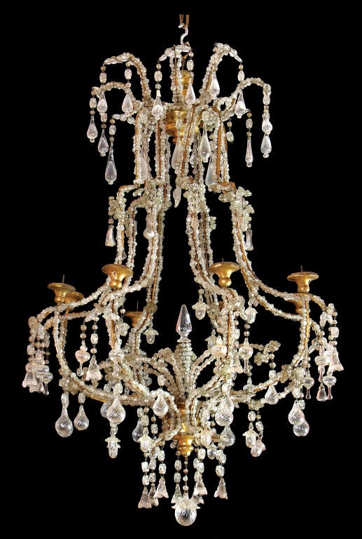 An Eight Light Chandelier Richly Hung With Various Crystals