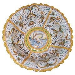 A Large Lobed Earthenware Bowl With Grotesque Decorations