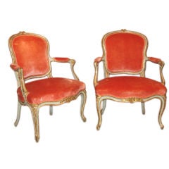 A Pair Of Italian Painted And Parcel Gilded Armchairs