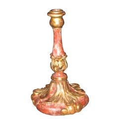 A Carved Wood Marbleized and Gilded Candlestick