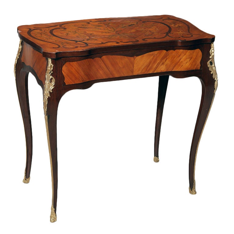 A marquetry table with gilt bronze mounts and secret drawer open For Sale