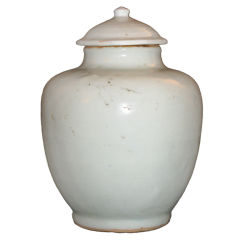A Chinese white porcelain baluster form vase with lid.