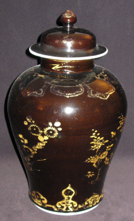 With a band of gilt lappets at the foot and the neck, the jar is decorated with the three friends in winter, peonies, chrysanthemums and roses.