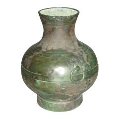 Patinated bronze vase with two ring handles