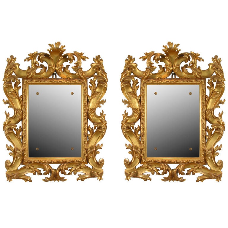 A Fine Pair of Carved and Gilded Mirrors For Sale
