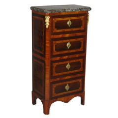 A Louis XVI parquetry chest-of-drawers with marble top