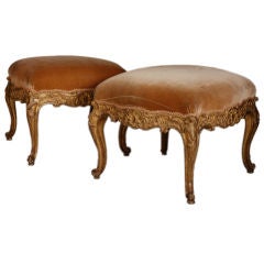 A pair of extraordinary gilded and carved Regence stools