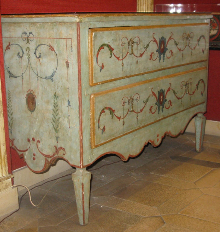 Italian A pale blue painted two-drawer commode with polychrome paint
