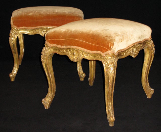 Literature:  Helen Fioratti, French Antiques, p. 51
A pair of carved and gilded beech wood stools, originally a set of four, two of which are now in the Virginia Museum. 
Of superb quality with original gilding.