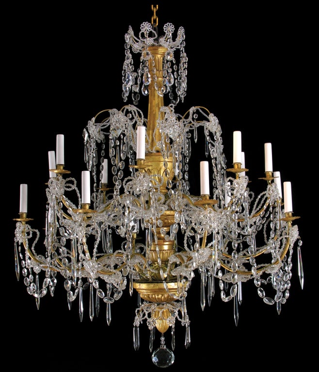 A very rare pair of Genoese sixteen light chandeliers