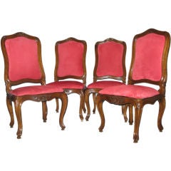 A set of four walnut side chairs