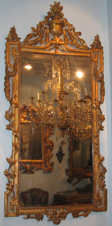 A Louis XVI painted and gilded wood mirror with Greek key design