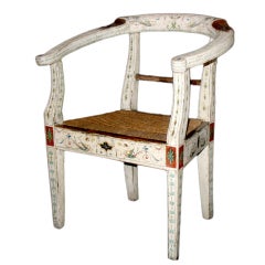 An Italian Neoclassic painted wood child’s armchair