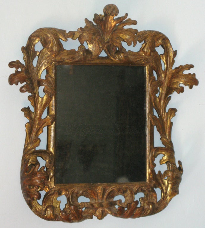 An elaborately carved and gilded Baroque mirror