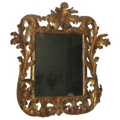 An elaborately carved and gilded Baroque mirror