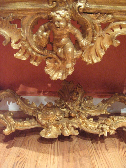 Italian An Elaborately Carved And Gilded Console Table For Sale