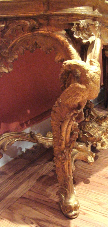 18th Century and Earlier An Elaborately Carved And Gilded Console Table For Sale
