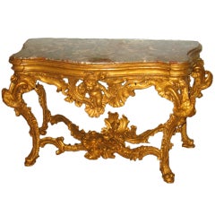 An Elaborately Carved And Gilded Console Table