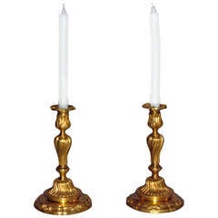 A pair of Louis XV gilt bronze candlesticks with a crowned C poinçon