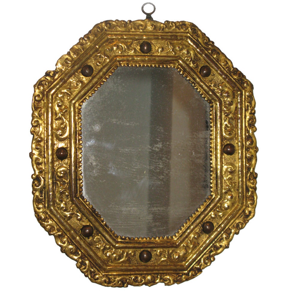 A Rare Gilt Copper Repousśe Octagonal Mirror with Inset Hard Stones For Sale