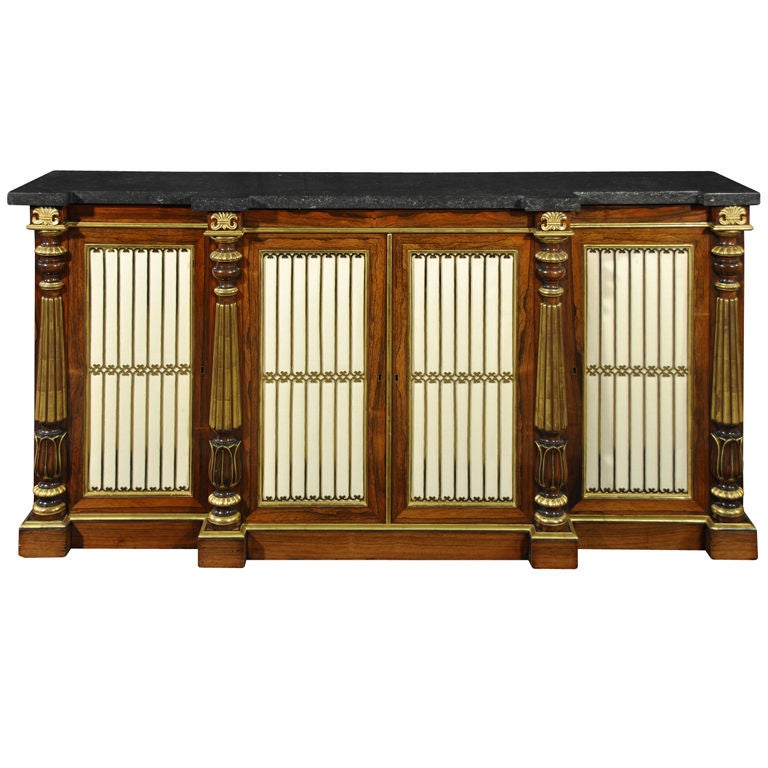 A Regency Rosewood And Parcel Gilt Black Marble Top Cabinet
