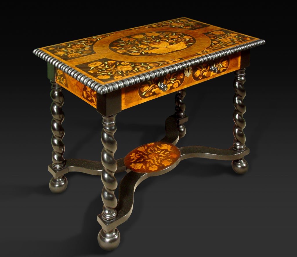 With one frieze drawer and simulated drawer to the reverse; on barley twist legs joined by a shaped platform stretcher with conforming inlays.
