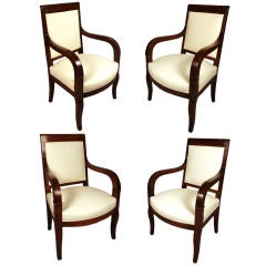 Set of Four Charles X Walnut Open Armchairs