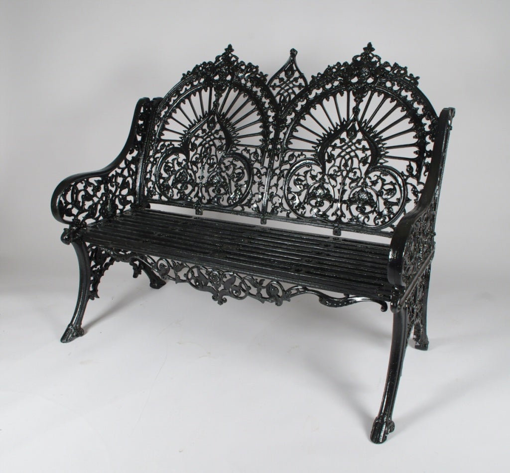 Fine cast iron garden bench by Robert Wood, the elaborate double back with strong Eastern /Indian influence.  The seat rail signed, “Robert [W]ood & Co.  Akers, Philada.”
This stunning bench was produced in both England and America.  A triple back