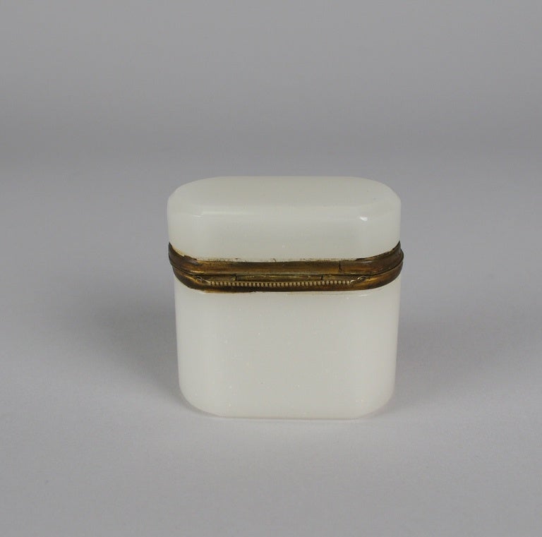 Small white opaline box, ormolu mounted with a thumb latch.