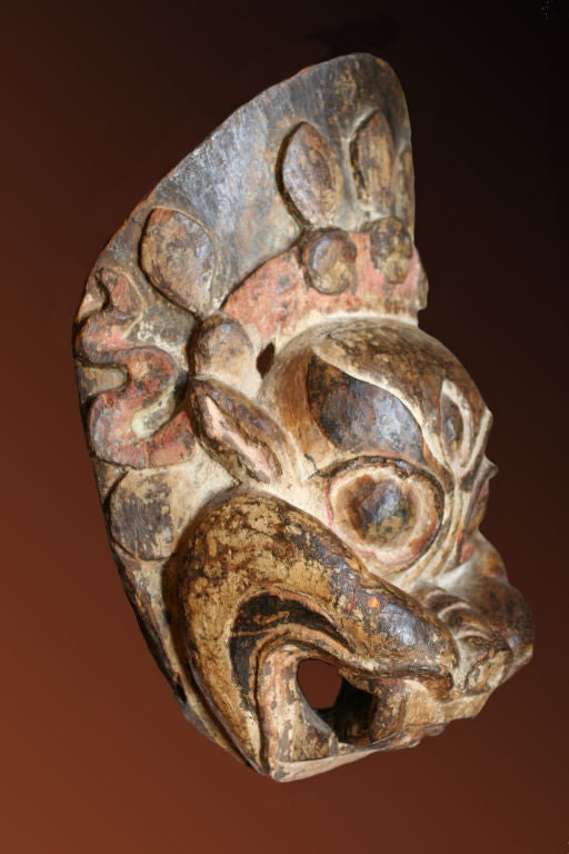 Large carved wood dance mask, possibly depicting a lion-faced protector. From a private collection.