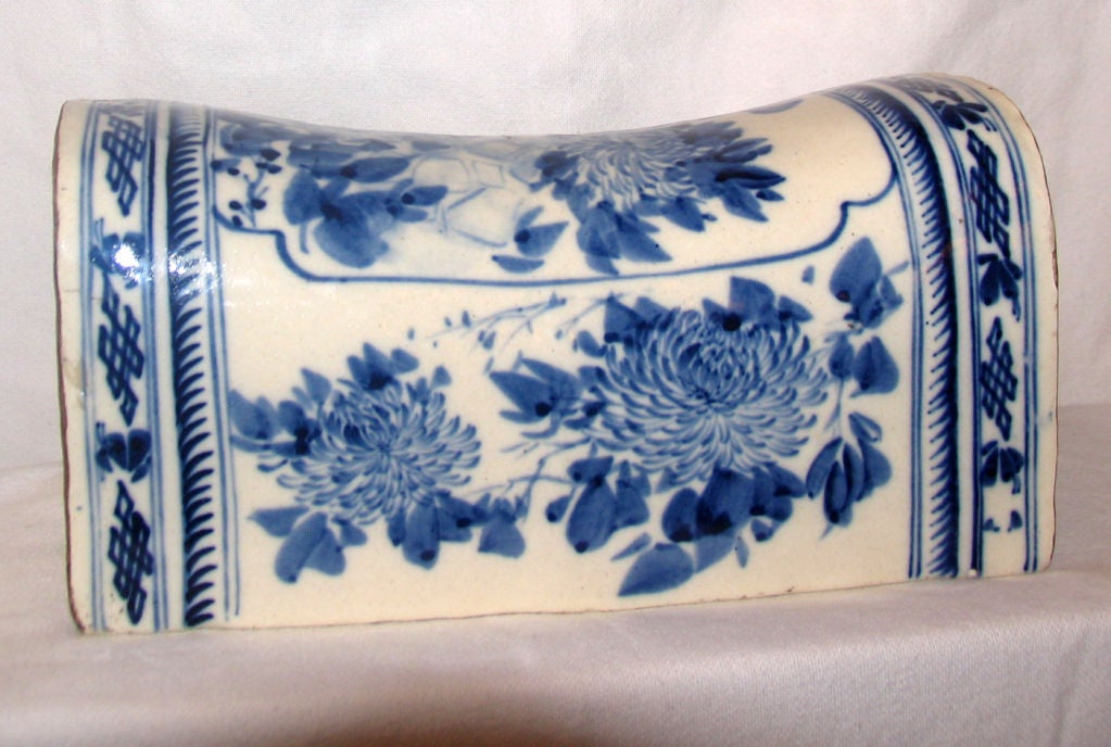Beautiful antique chinese porcelain pillow in the Ching Style of rectangular shape handpainted with blue and white floral decoration.